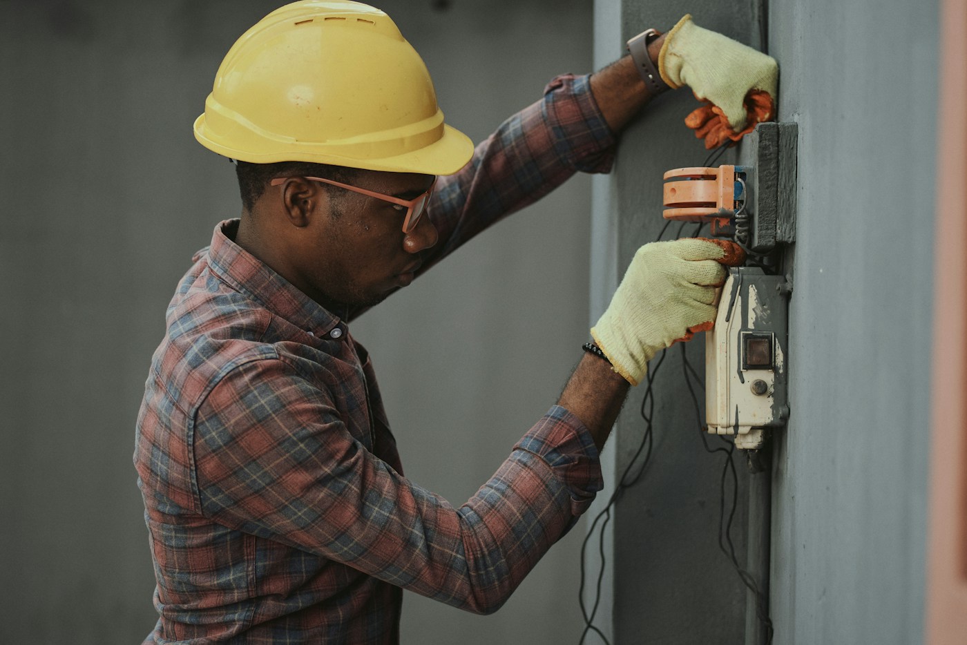 An electrician focused on installation work